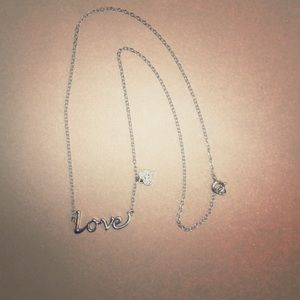 Silver LOVE Necklace with tiny heart pendant.